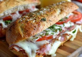 Toasted Italian grinder sandwiches filled with deli meats, melted cheese, and crispy bread.