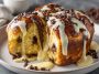 Soft brioche filled with vanilla custard and chocolate chips, baked until golden and slightly glossy on top.