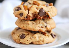Peanut butter cookies loaded with chocolate chips and crunchy pretzel pieces, baked until golden.