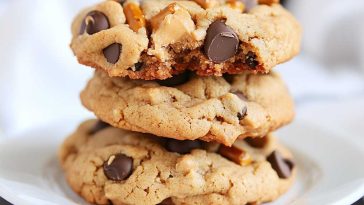 Peanut butter cookies loaded with chocolate chips and crunchy pretzel pieces, baked until golden.