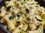 Rigatoni pasta with zucchini, lemon sauce, and Parmesan cheese served in a bowl