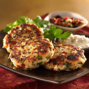 Mediterranean chicken patties with herbs and spices, pan-seared until golden and served with a light sauce.