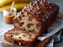 Moist chocolate chip banana bread with sliced bananas and melted chocolate chips throughout.