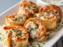 Creamy garlic parmesan shrimp roll-ups filled with juicy shrimp and cheese, baked until golden and bubbly.