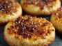 Crème brûlée cookies with caramelized sugar topping on a plate
