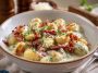 Millionaire gnocchi in creamy garlic parmesan sauce served in a bowl