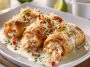 Crab and shrimp queso rollo filled with creamy cheese and seafood, sliced into bite-sized rolls.