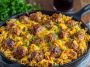 BBQ ranch meatball and cheddar pasta skillet topped with melted cheese
