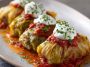 Tender cabbage rolls stuffed with a flavorful vegetarian filling of rice, vegetables, and herbs, baked in a rich tomato sauce.