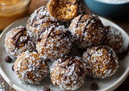 No-bake chocolate peanut butter protein balls made with oats, cocoa, and peanut butter, rolled into bite-sized snacks.