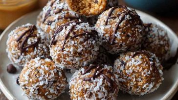 No-bake chocolate peanut butter protein balls made with oats, cocoa, and peanut butter, rolled into bite-sized snacks.