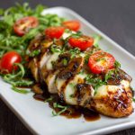 Juicy baked chicken breast glazed with balsamic sauce and topped with melted mozzarella cheese.
