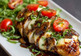 Juicy baked chicken breast glazed with balsamic sauce and topped with melted mozzarella cheese.