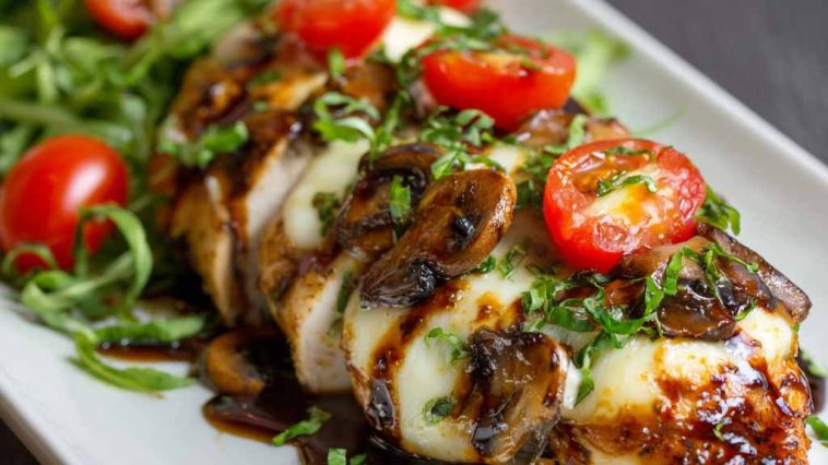 Juicy baked chicken breast glazed with balsamic sauce and topped with melted mozzarella cheese.