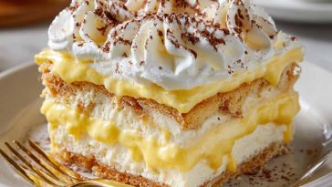 No-bake lemon éclair cake with creamy layers and lemon glaze