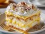 No-bake lemon éclair cake with creamy layers and lemon glaze