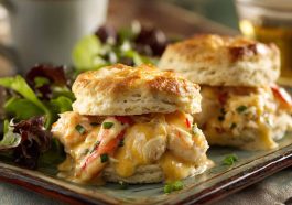 Savory shrimp and crab biscuit melts topped with melted cheese and herbs on golden biscuits.