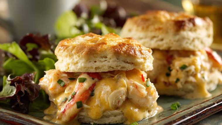 Savory shrimp and crab biscuit melts topped with melted cheese and herbs on golden biscuits.