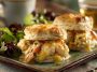 Savory shrimp and crab biscuit melts topped with melted cheese and herbs on golden biscuits.