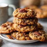 Thick oatmeal cookies with pecans and a pecan pie-style filling, chewy and golden.