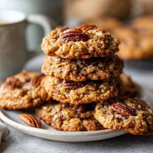 Thick oatmeal cookies with pecans and a pecan pie-style filling, chewy and golden.