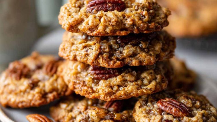 Thick oatmeal cookies with pecans and a pecan pie-style filling, chewy and golden.