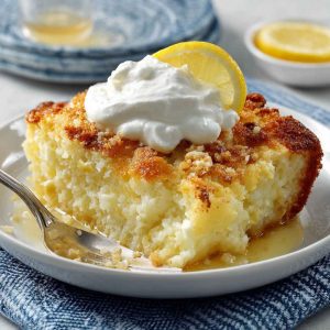 Lemon cream cheese dump cake with a golden buttery topping and creamy layers.