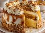 Butterscotch crunch cake layered with creamy frosting and topped with crunchy butterscotch bits and caramel drizzle.