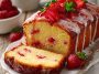 Fresh lemony Greek strawberry pound cake topped with juicy strawberries and a light glaze.
