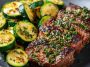 Garlic butter steak with sautéed zucchini, cooked to perfection with a rich, glossy sauce.