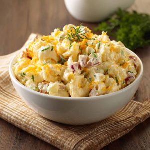 Creamy macaroni salad with cheddar cheese and sour cream dressing.