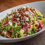 La Scala chopped salad with lettuce, salami, mozzarella, and chickpeas