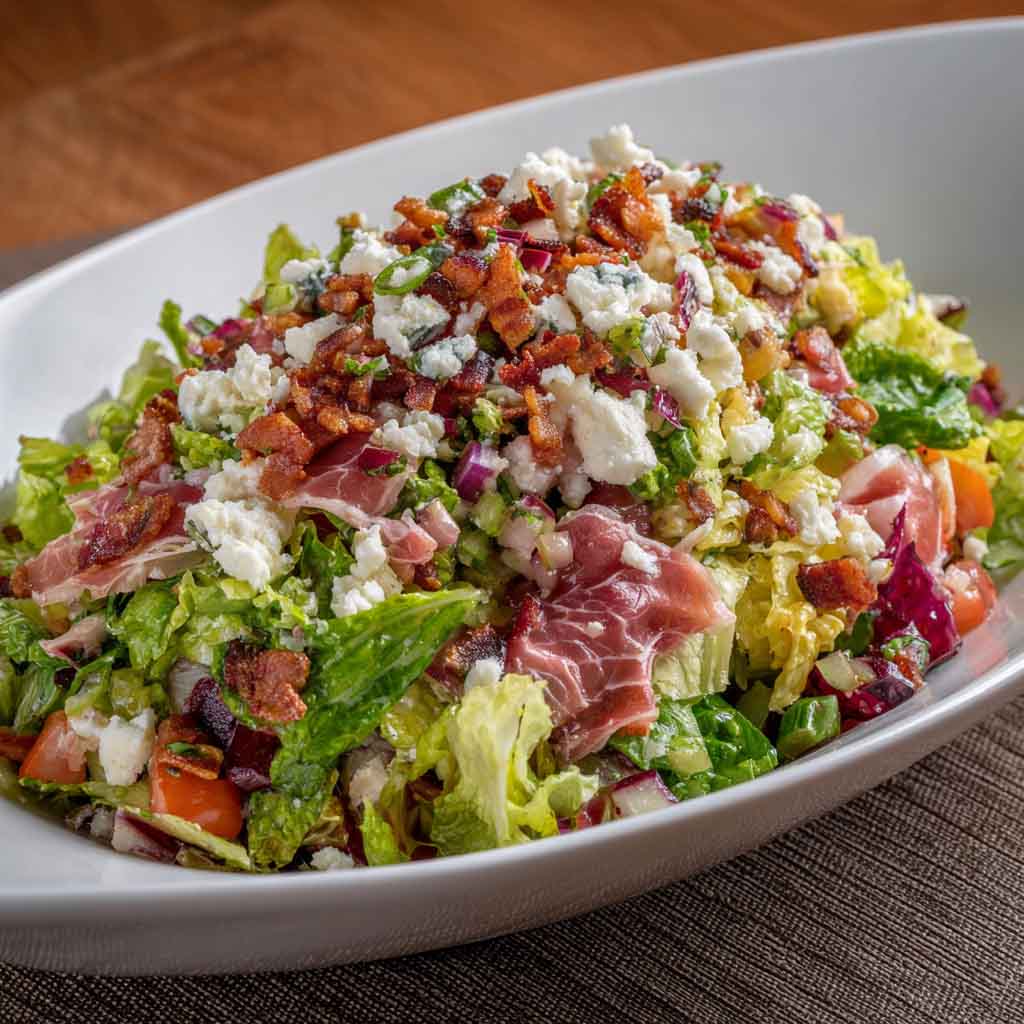 La Scala chopped salad with lettuce, salami, mozzarella, and chickpeas
