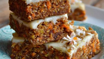 Healthy Easter carrot cake bars topped with light cream cheese frosting and festive sprinkles.