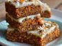 Healthy Easter carrot cake bars topped with light cream cheese frosting and festive sprinkles.