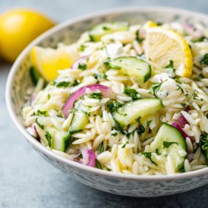 Light cucumber lemon orzo salad with fresh herbs, crisp cucumbers, and a bright citrus dressing.