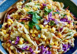 Fresh crunchy corn slaw made with sweet corn, shredded cabbage, colorful peppers, and a creamy tangy dressing.