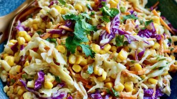 Fresh crunchy corn slaw made with sweet corn, shredded cabbage, colorful peppers, and a creamy tangy dressing.