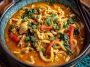 Udon noodles with chicken in creamy coconut red curry sauce, rich and flavorful.