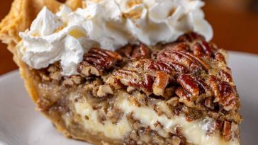 Creamy pecan pie with a smooth filling and crunchy toasted pecans on top.