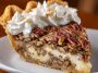 Creamy pecan pie with a smooth filling and crunchy toasted pecans on top.