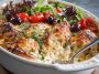 Greek chicken casserole with herbs, lemon, and baked vegetables in a single dish.