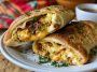 Homemade breakfast hot pockets filled with eggs, cheese, and sausage.