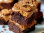 Fudgy Biscoff brownies with swirls of cookie butter on top, cut into squares with a rich, gooey center.