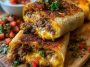 Golden crispy beef and cheese chimichangas filled with seasoned ground beef and melted cheese, served with salsa and sour cream.