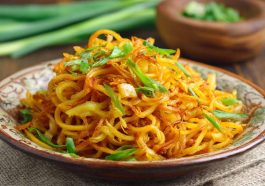 Spicy potato noodles stir-fried with chili sauce and vegetables