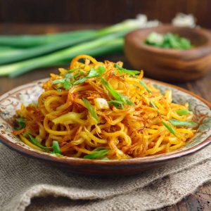 Spicy potato noodles stir-fried with chili sauce and vegetables