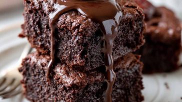 Fudgy vegan brownies with rich chocolate texture and gooey center.