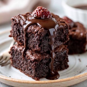 Fudgy vegan brownies with rich chocolate texture and gooey center.