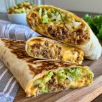 Big Mac wrap filled with beef, lettuce, cheese, pickles, and burger sauce.